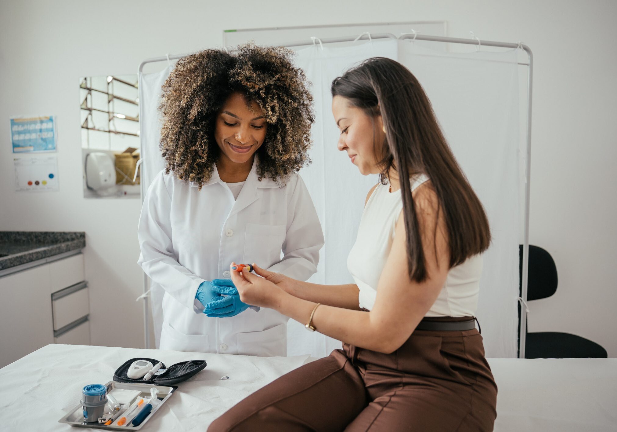 Healthcare professional explaining how to use insulin